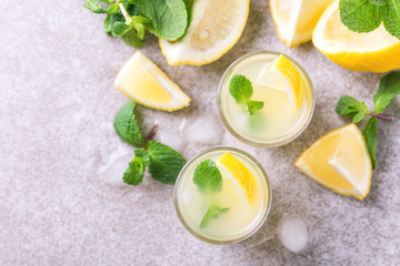 Italian lemon lime liqueur limoncello with ice and mint
