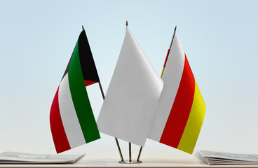 Flags of Kuwait and South Ossetia with a white flag in the middle