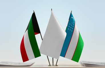 Flags of Kuwait and Uzbekistan with a white flag in the middle