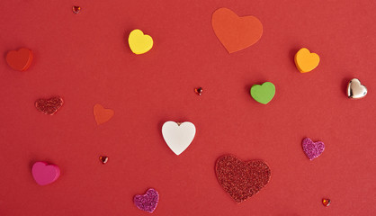 A lot of differen hearts. over red background. Valentines day card