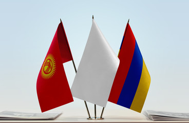 Flags of Kyrgyzstan and Armenia with a white flag in the middle