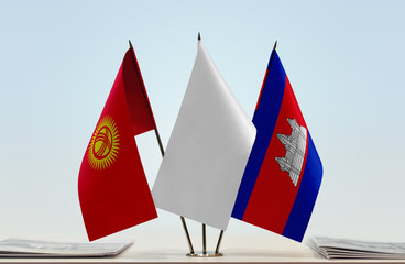 Flags of Kyrgyzstan and Cambodia with a white flag in the middle