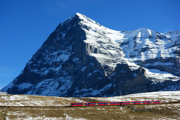 North face of Eiger mountain and Wengernalp Railway, Jungfrau region, Switzerland - obrazy, fototapety, plakaty