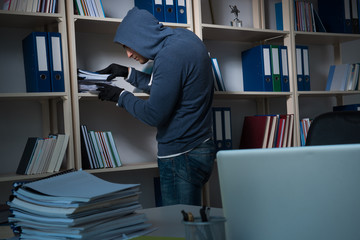 Young man in industrial espionage concept