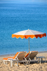 Mediterranean beach resort with chair and sun umbrella summer holiday vacation photo
