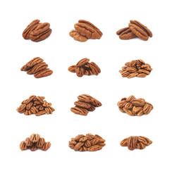 Pile of pecan nuts isolated - obrazy, fototapety, plakaty