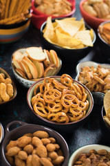 Salty snacks served in bowls