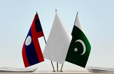 Flags of Laos and Pakistan with a white flag in the middle