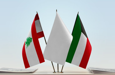 Flags of Lebanon and Kuwait with a white flag in the middle