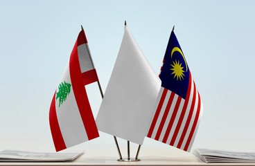 Flags of Lebanon and Malaysia with a white flag in the middle