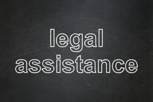 Law concept: text Legal Assistance on Black chalkboard background
