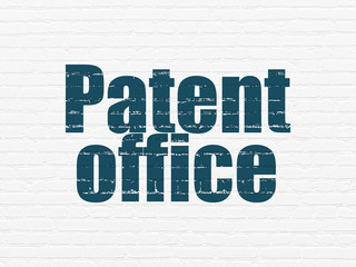 Law concept: Painted blue text Patent Office on White Brick wall background