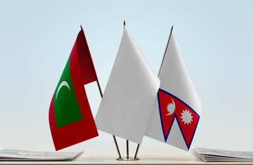 Flags of Maldives and Nepal with a white flag in the middle