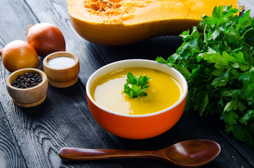 Pumpkin soup served on the table in bowl