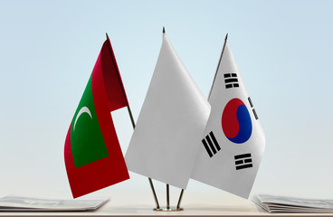 Flags of Maldives and South Korea with a white flag in the middle