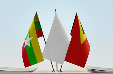 Flags of Myanmar and East Timor with a white flag in the middle