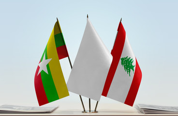 Flags of Myanmar and Lebanon with a white flag in the middle