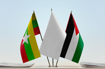 Flags of Myanmar and Palestine with a white flag in the middle