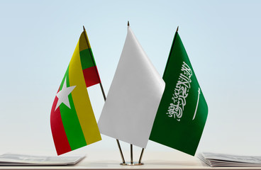 Flags of Myanmar and Saudi Arabia with a white flag in the middle