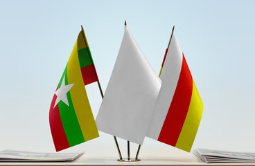 Flags of Myanmar and South Ossetia with a white flag in the middle