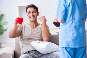 Patient getting blood transfusion in hospital clinic