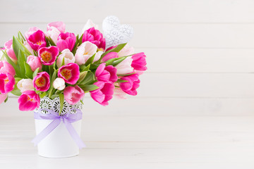 Pink tulip on the white background. Easter background