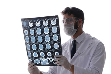 Young doctor looking at x-ray images isolated on white