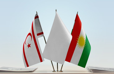 Flags of Northern Cyprus and Kurdistan with a white flag in the middle