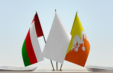 Flags of Oman and Bhutan with a white flag in the middle