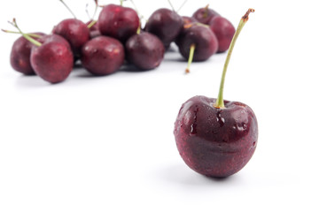 Sweet red cherries isolated on a white background.