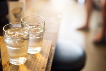 Water in a glass, selective focus