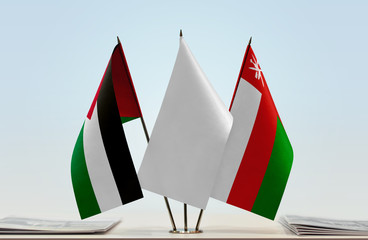 Flags of Palestine and Oman with a white flag in the middle