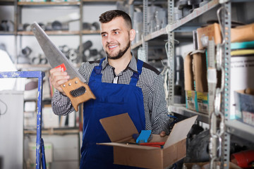 Man worker showing his working tools