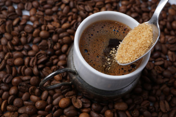 Close up of adding brown sugar in traditional Turkish coffee