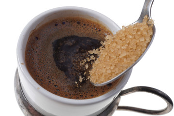 Close up of adding brown sugar in traditional Turkish coffee