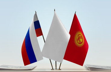 Flags of Russian Federation and Kyrgyzstan with a white flag in the middle