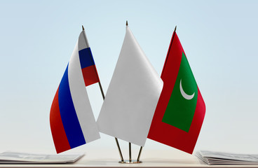 Flags of Russian Federation and Maldives with a white flag in the middle