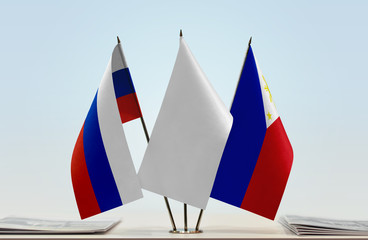 Flags of Russian Federation and Philippines with a white flag in the middle