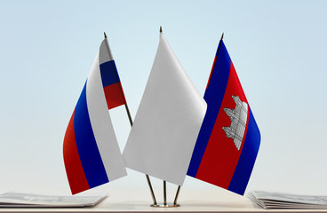 Flags of Russian Federation and Cambodia with a white flag in the middle