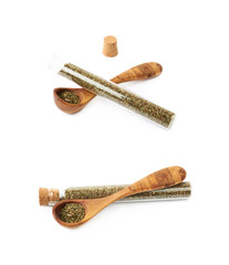 Herbal spices in a glass vial isolated