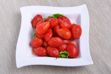 Peeled plum tomatoes on a plate     
