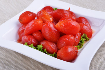 Peeled plum tomatoes on a plate     