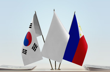Flags of  South Korea and Philippines with a white flag in the middle