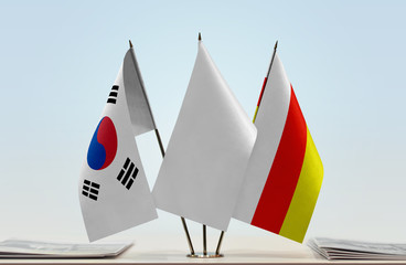 Flags of  South Korea and South Ossetia with a white flag in the middle