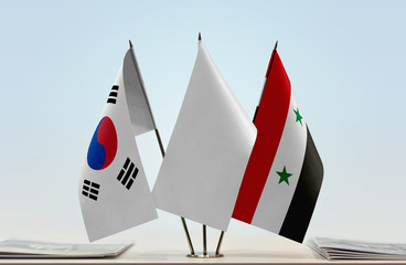 Flags of  South Korea and Syria with a white flag in the middle