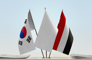 Flags of  South Korea and Yemen with a white flag in the middle