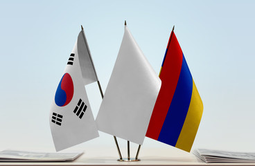 Flags of  South Korea and Armenia with a white flag in the middle