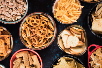 Salty snacks served in bowls