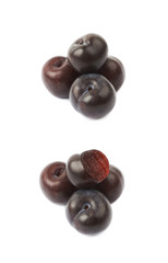 Pile of black plums isolated