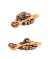 Wooden spoon of cocoa beans isolated